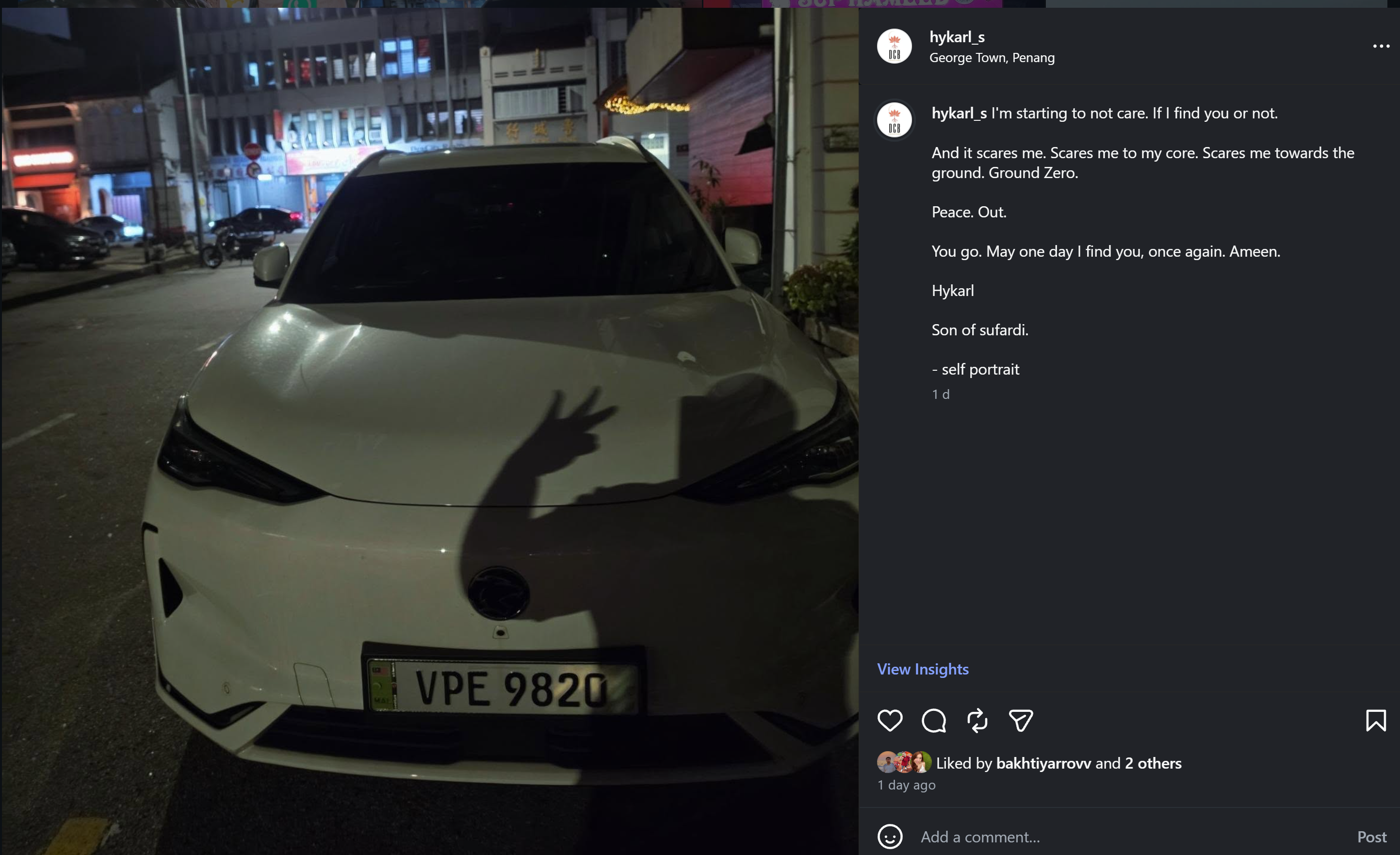 Hykarl’s self-portrait shared from George Town, Penang: his shadow raises a peace sign across a white car at night, with his original post alongside.